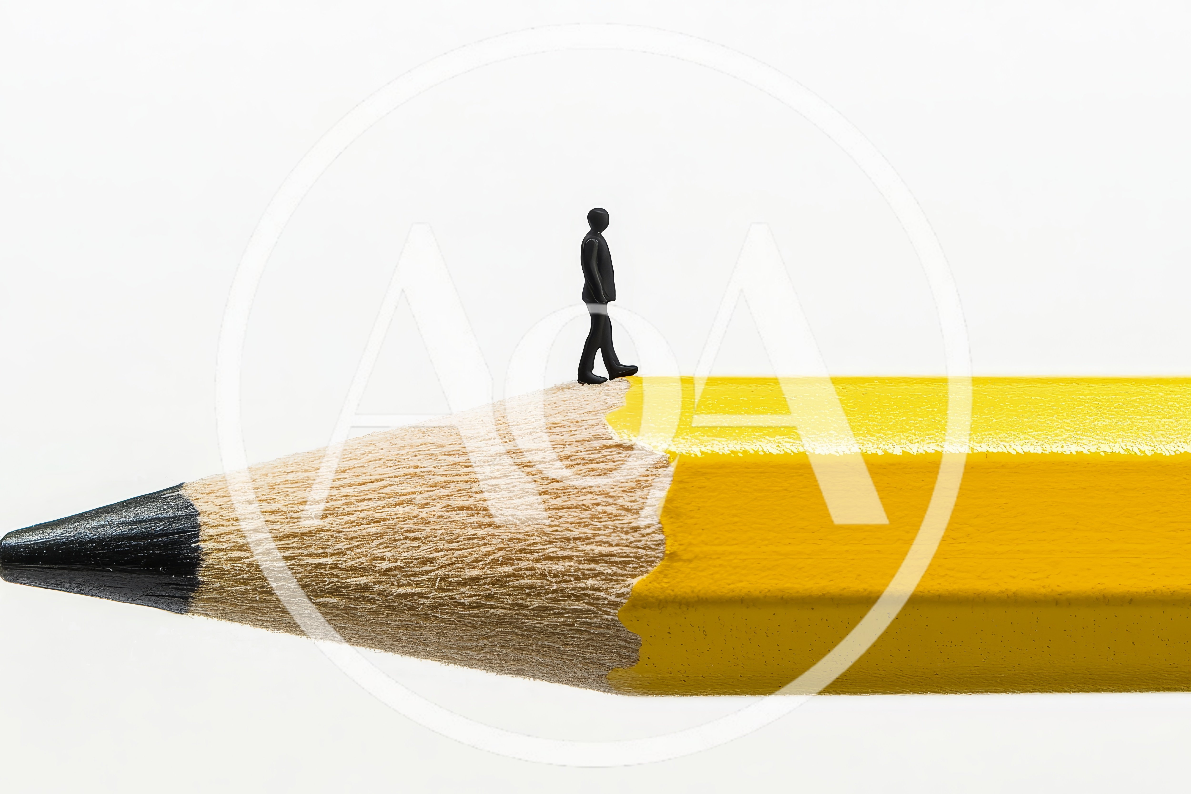 Miniature Business Person Walking On A Pencil Tip