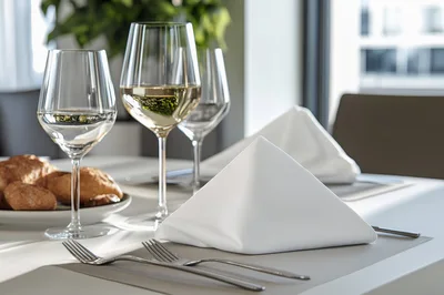 Elegant Table Setting With Wine Glasses And Napkins