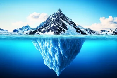 Iceberg Mountain Peak Floating In Deep Blue Ocean