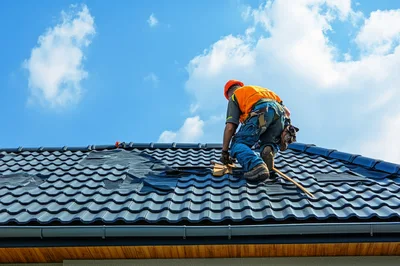 Roofer Installing Tiles on a Residential Roof
