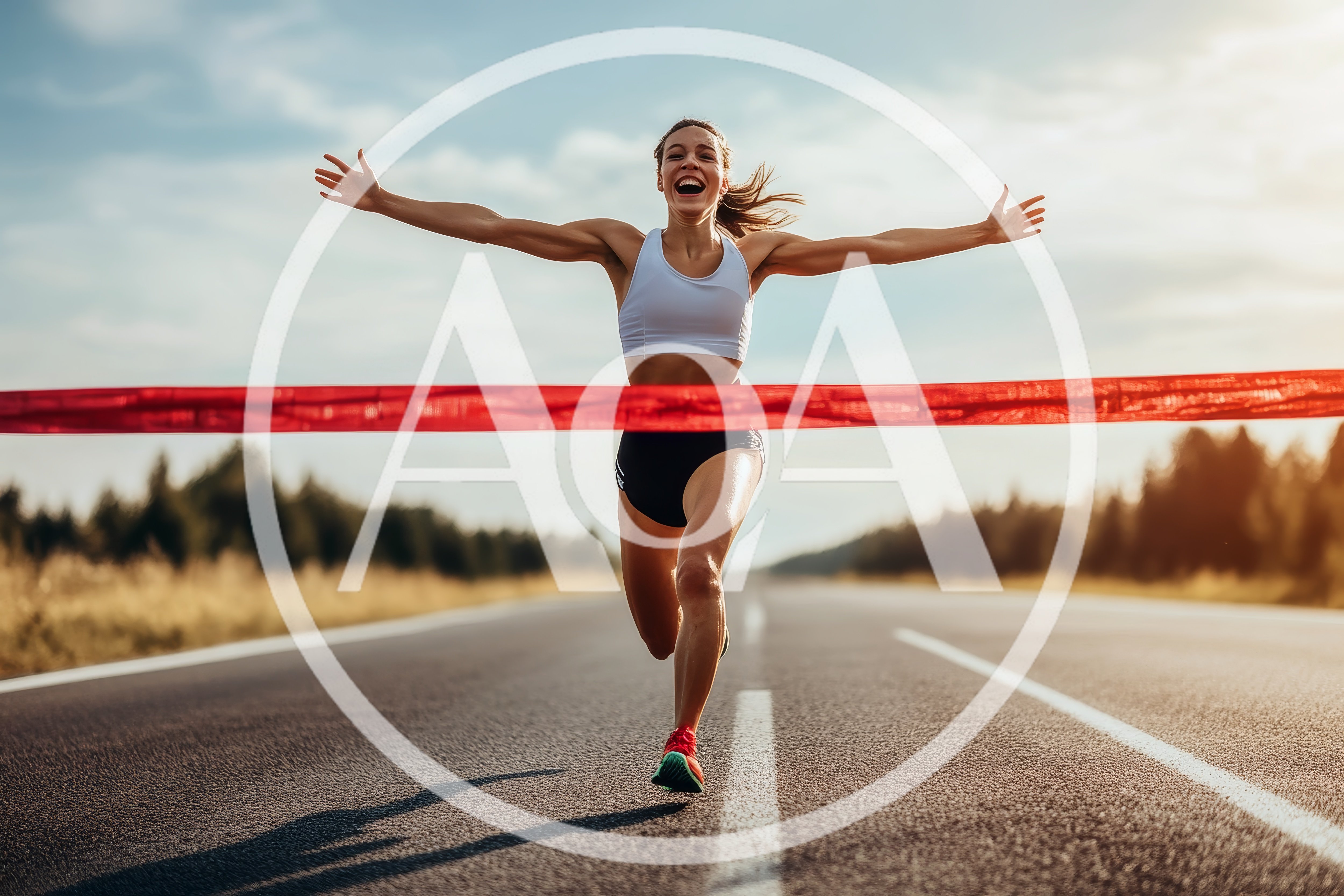Female Runner Crossing Finish Line With Arms Raised