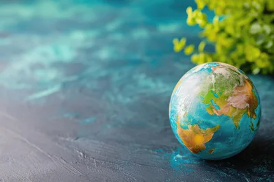 Globe Model on Textured Blue Surface