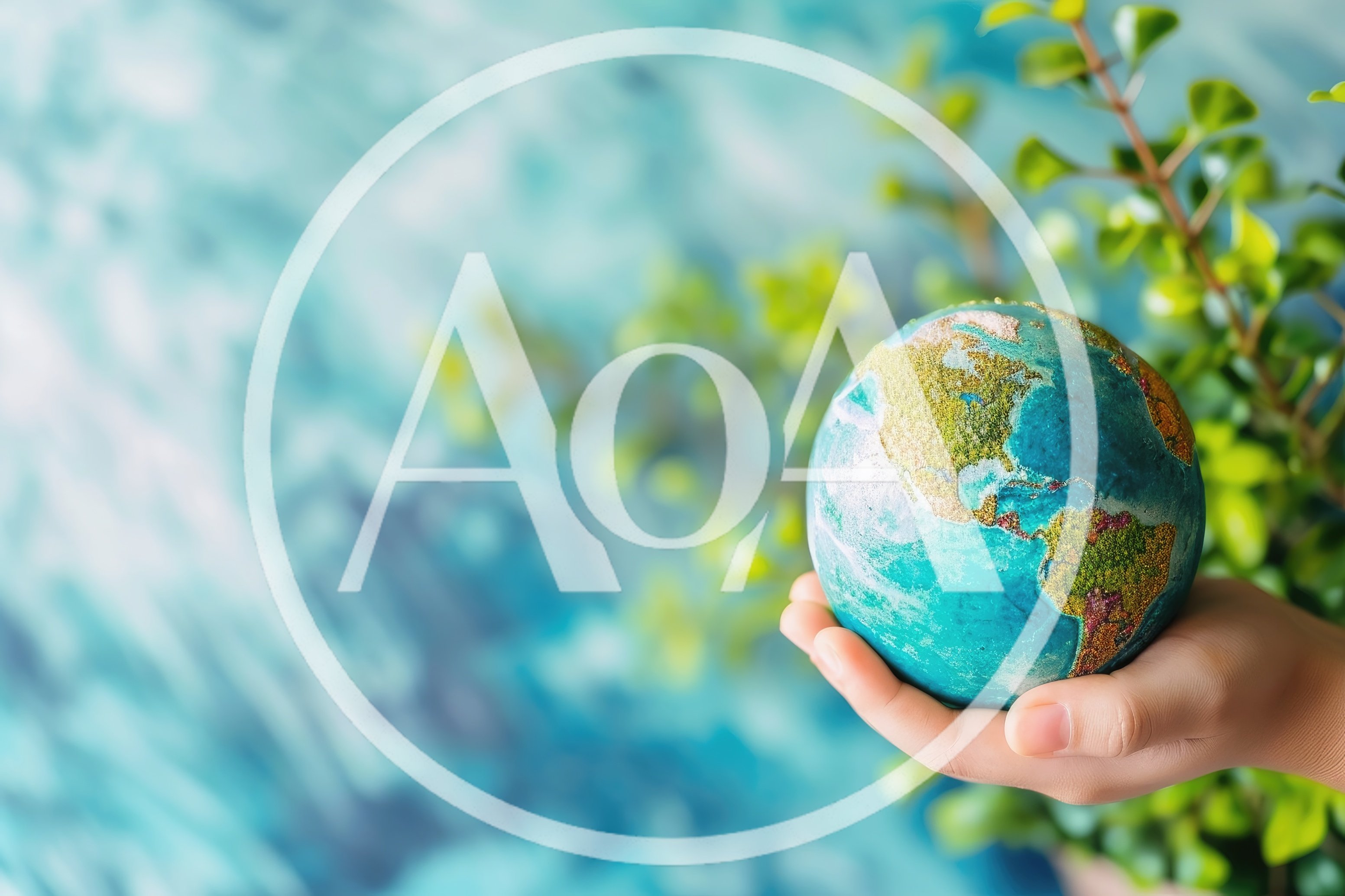 Hand Holding A Miniature Globe With Green Continents