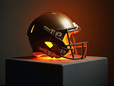 Golden Football Helmet Illuminated on a Pedestal