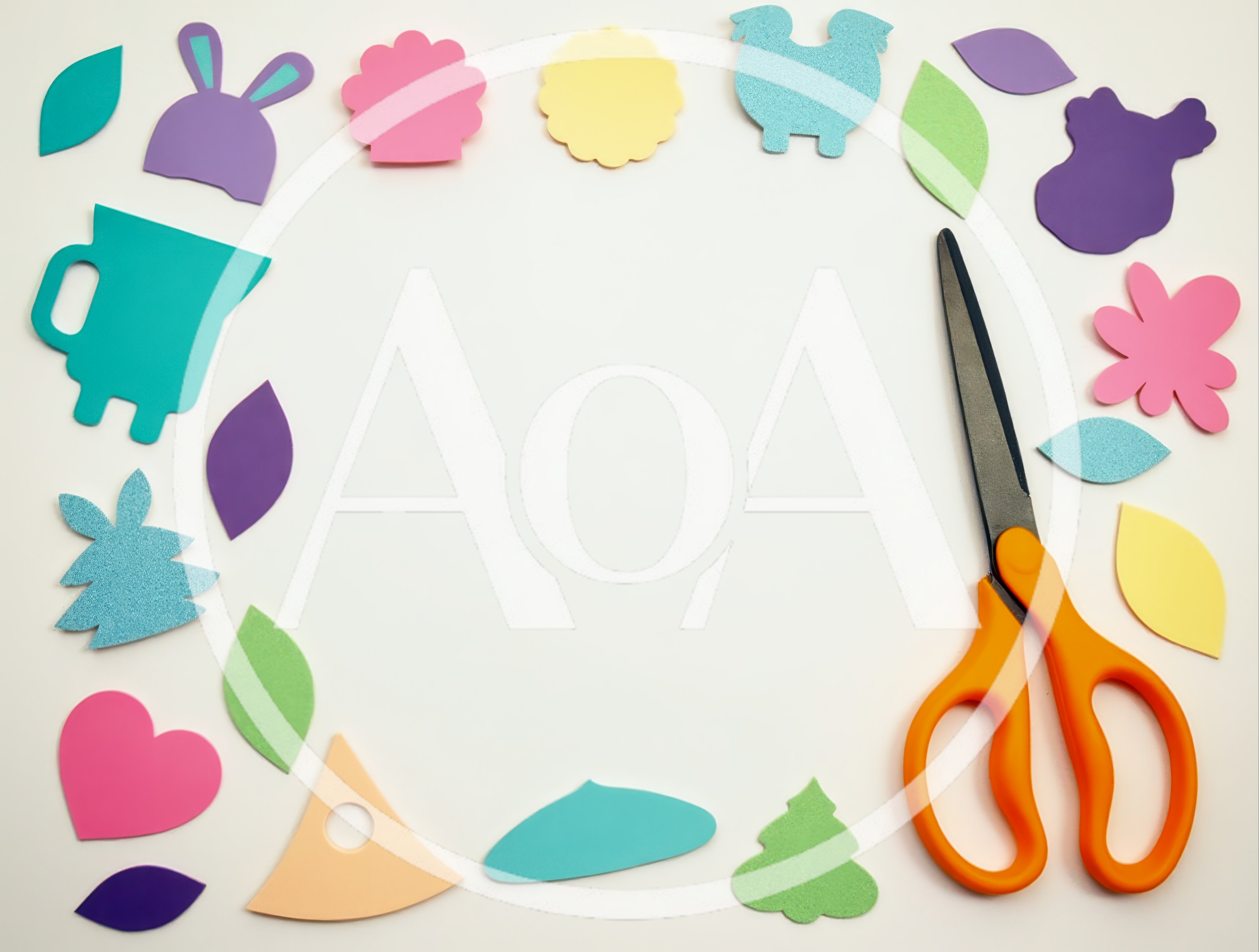 Craft Supplies Arranged Around Scissors on White Background