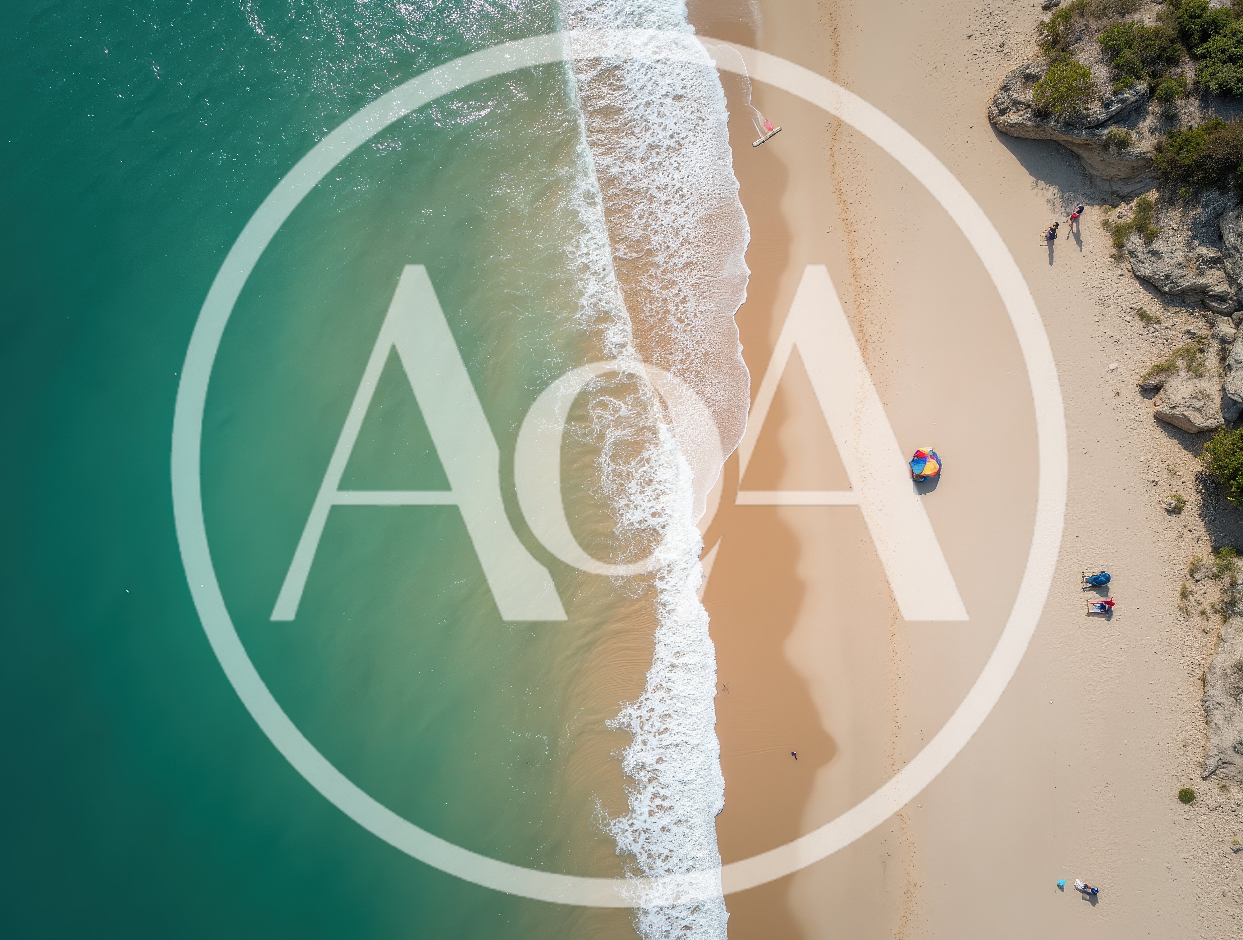 Aerial View Of A Sandy Beach With Turquoise Water