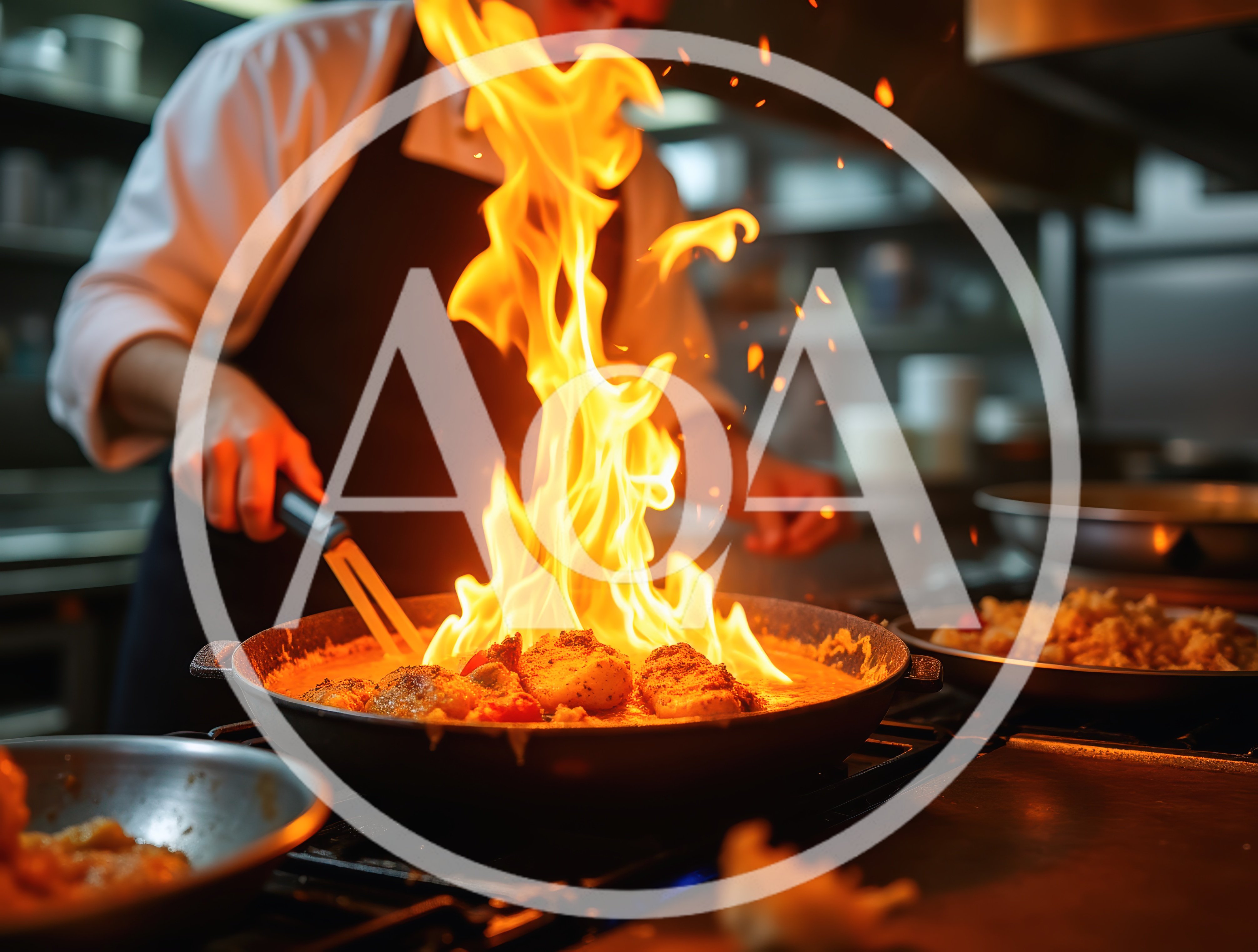 Professional Chef Flambeing Food In A Restaurant Kitchen