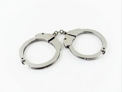 Silver Metal Handcuffs Isolated on White Background