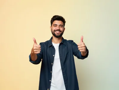 Smiling Young Man Giving Double Thumbs Up