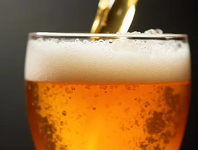 Golden Beer Pouring Into A Glass