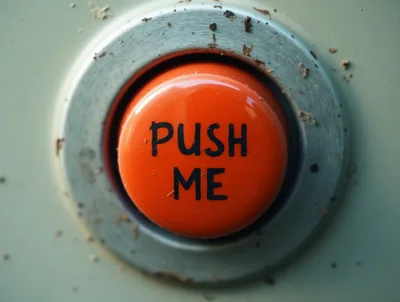 Close Up Of A Red Push Me Button