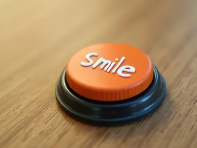 Orange Smile Button On A Wooden Surface