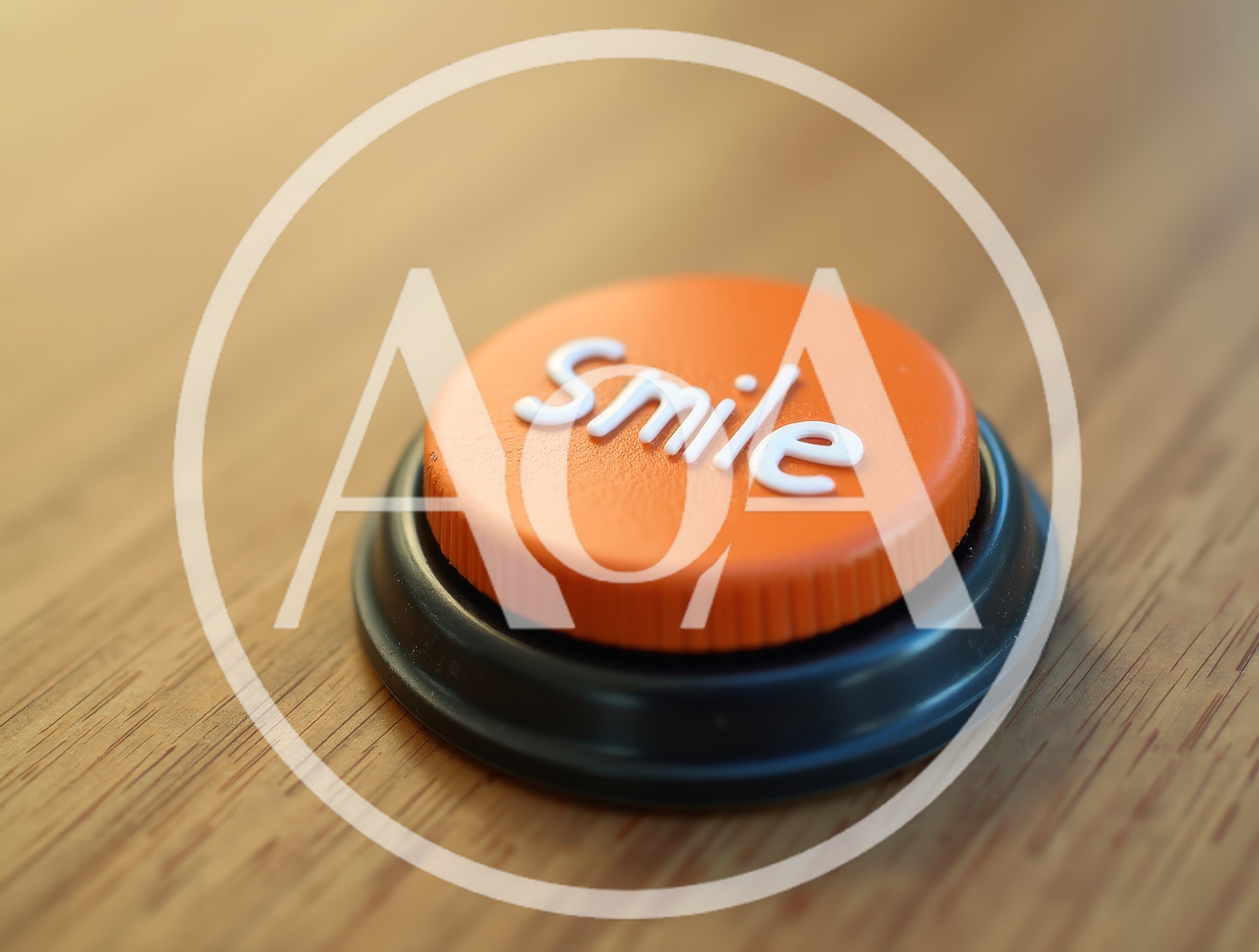 Orange Smile Button On A Wooden Surface