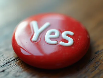 Red Yes Button On Wooden Surface