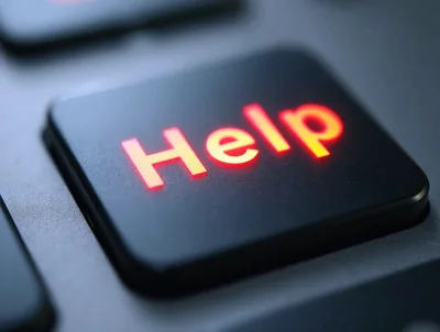 Glowing Help Key On A Computer Keyboard