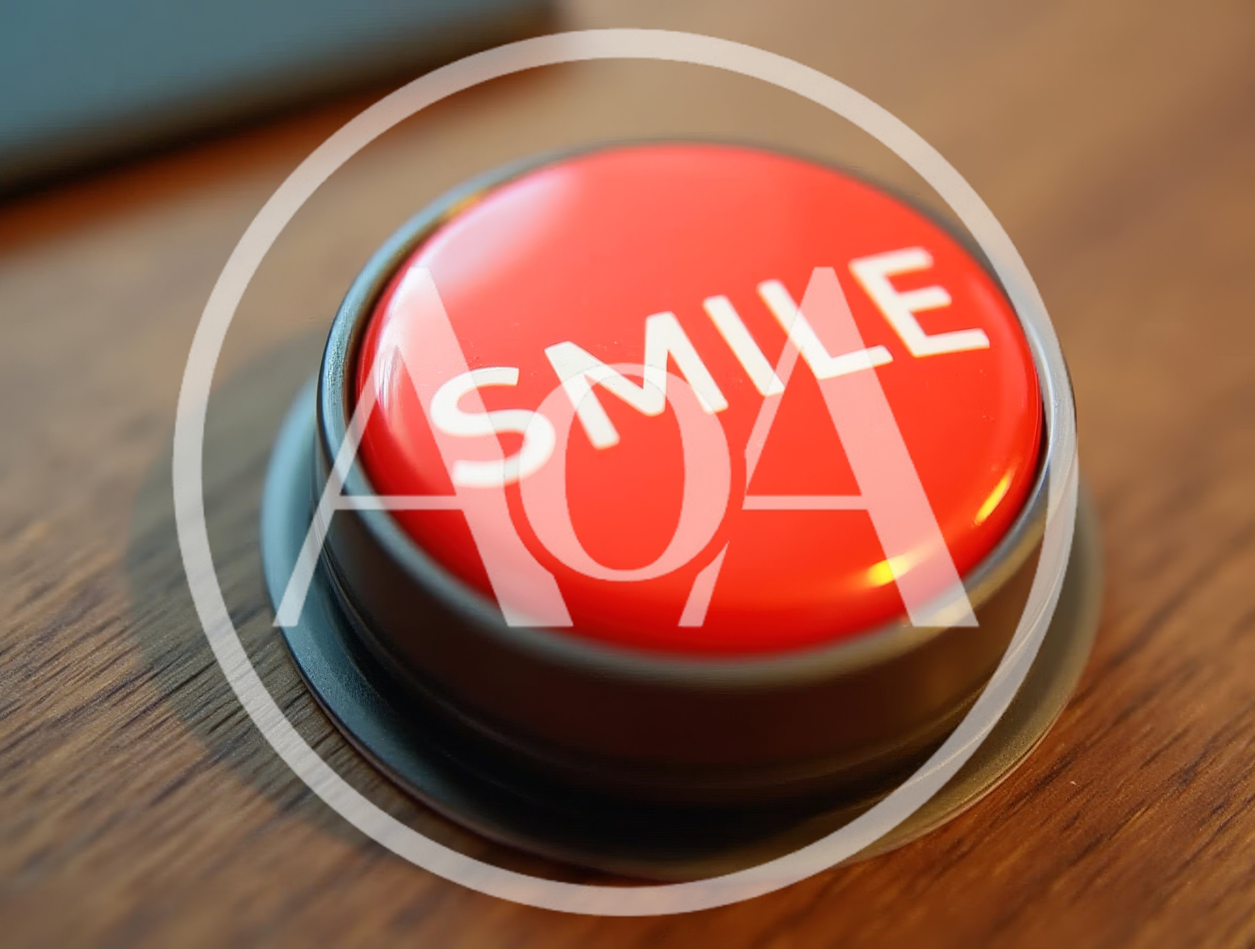 Red Push Button With Smile Text On Wooden Surface