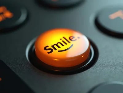 Glowing Orange Smile Button On A Dark Control Panel