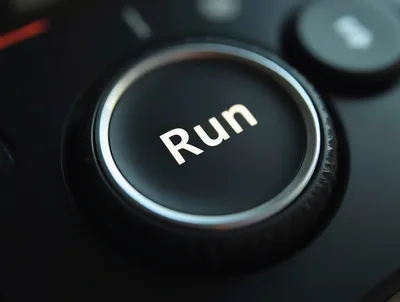 Close Up Of A Black Run Button