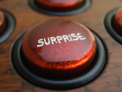 Red Surprise Button On A Wooden Console