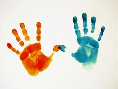 Orange And Blue Handprints On White Background