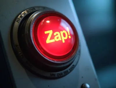 Close Up Of A Glowing Red Zap Button