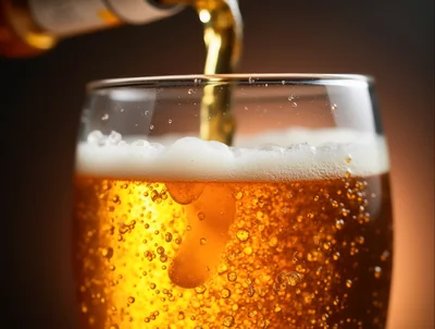 Golden Beer Pouring Into A Glass