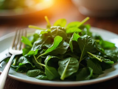 Fresh Green Spinach Salad On A White Plate