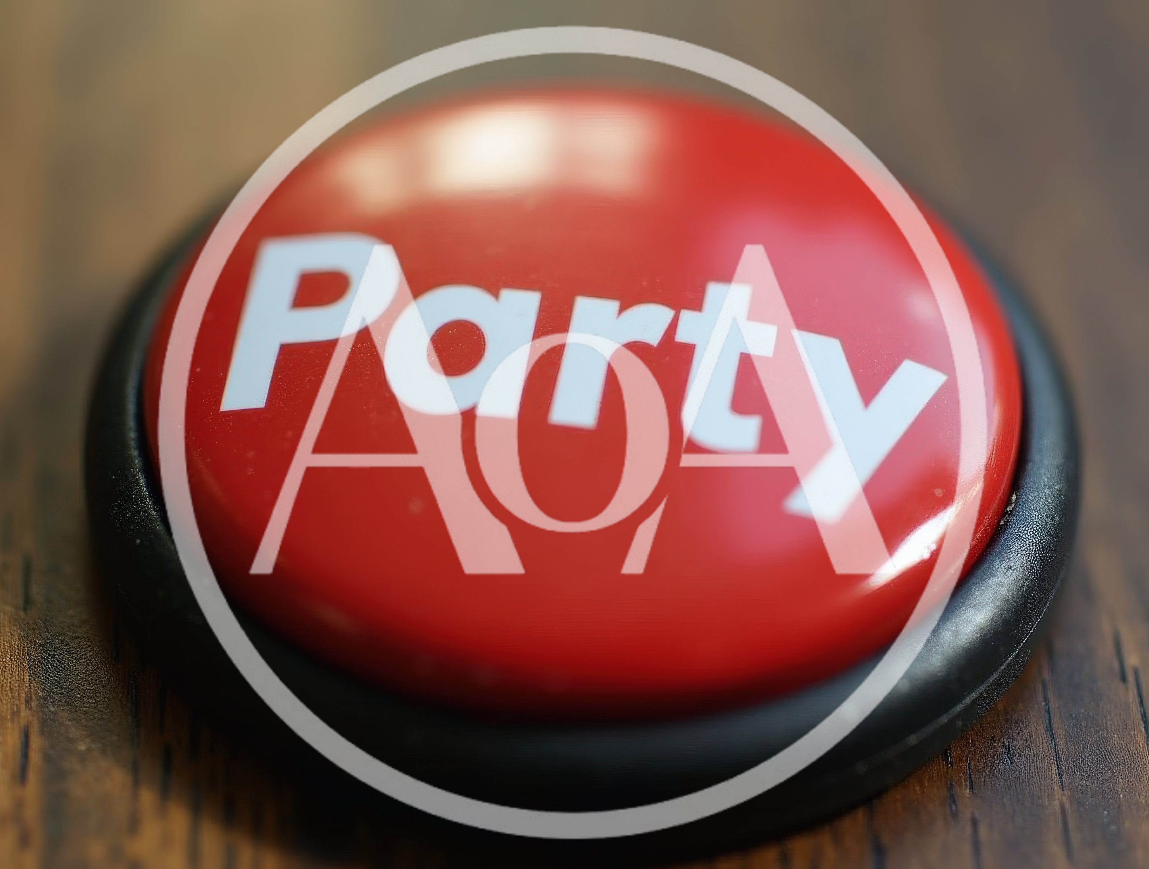 Red Party Button On A Wooden Surface