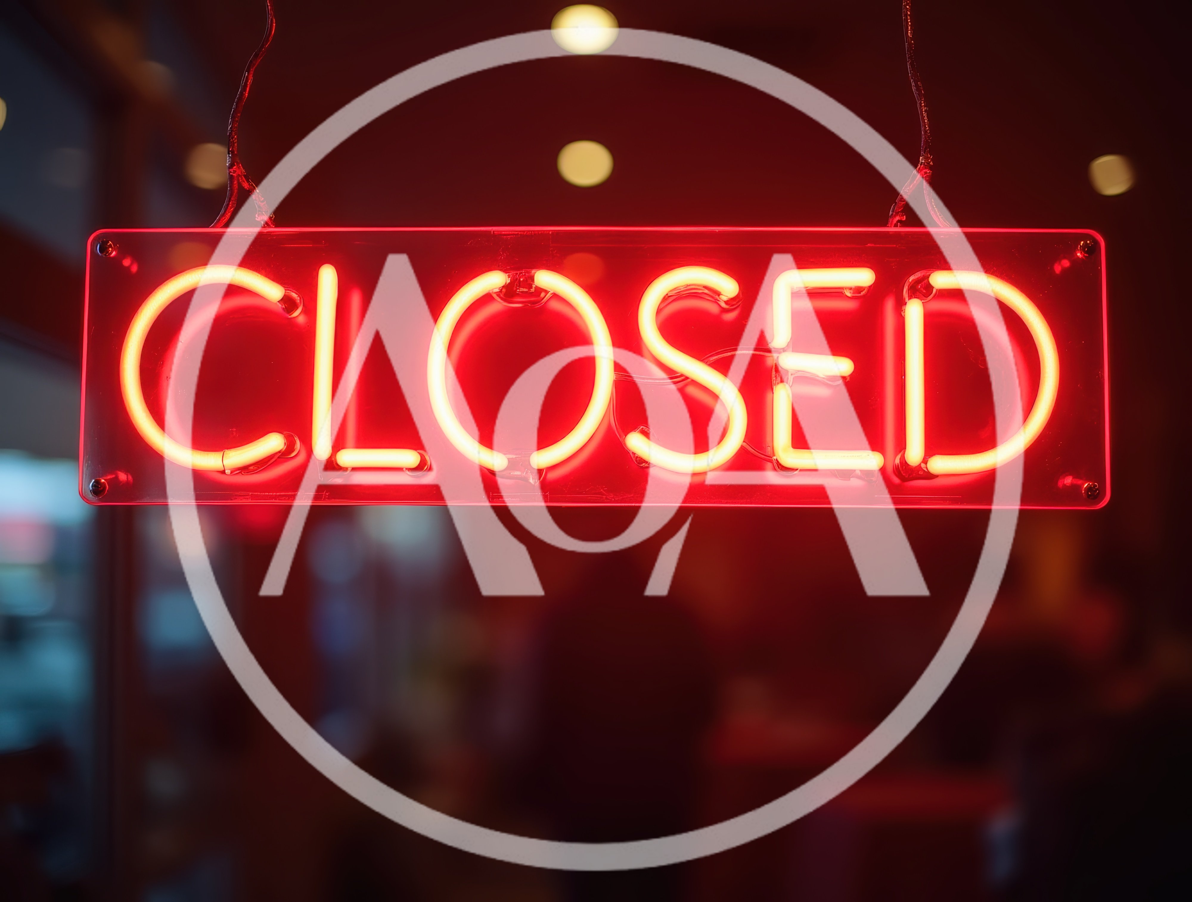 Red Neon Closed Sign Hanging In A Window