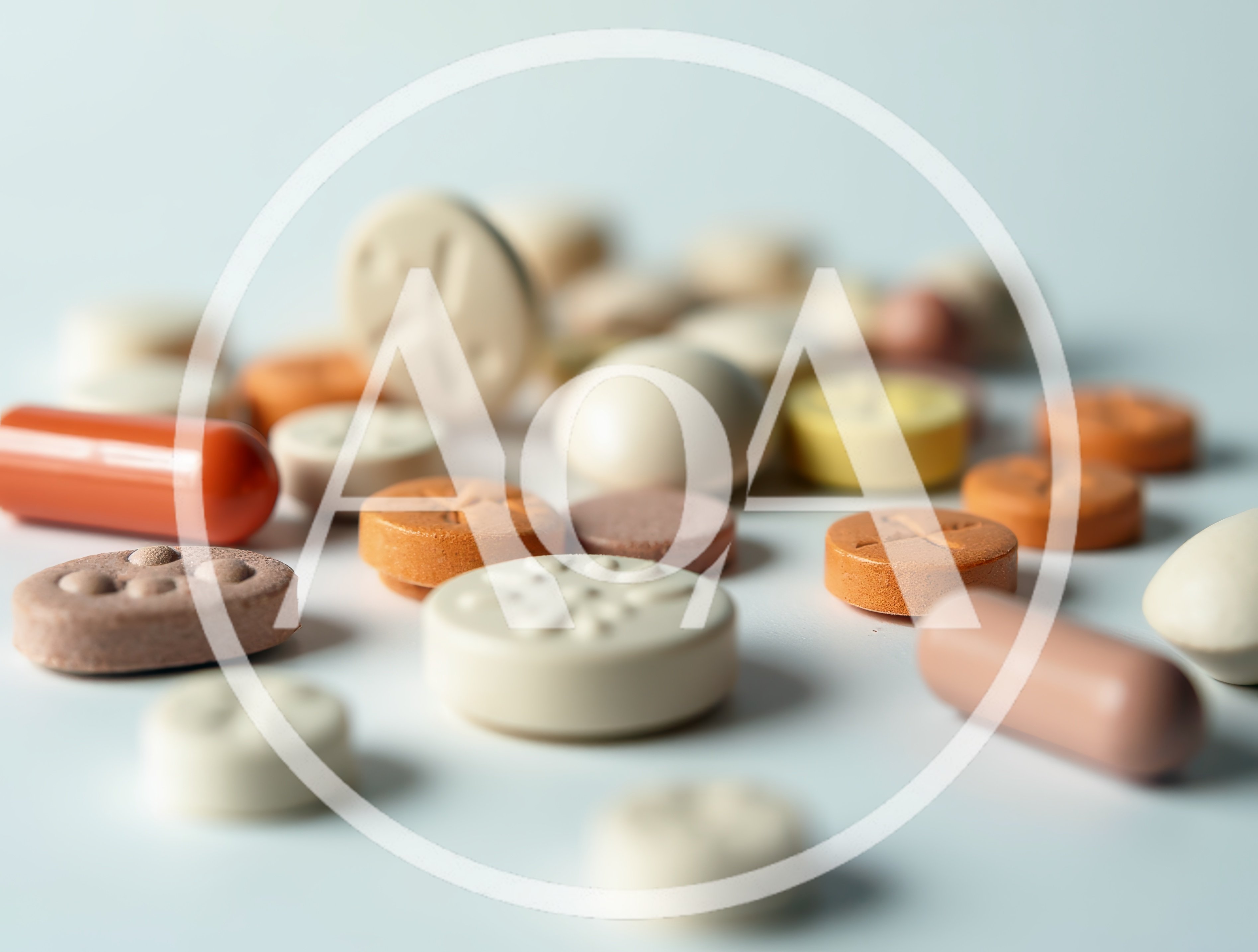 Assorted Pharmaceutical Pills and Capsules on White Surface