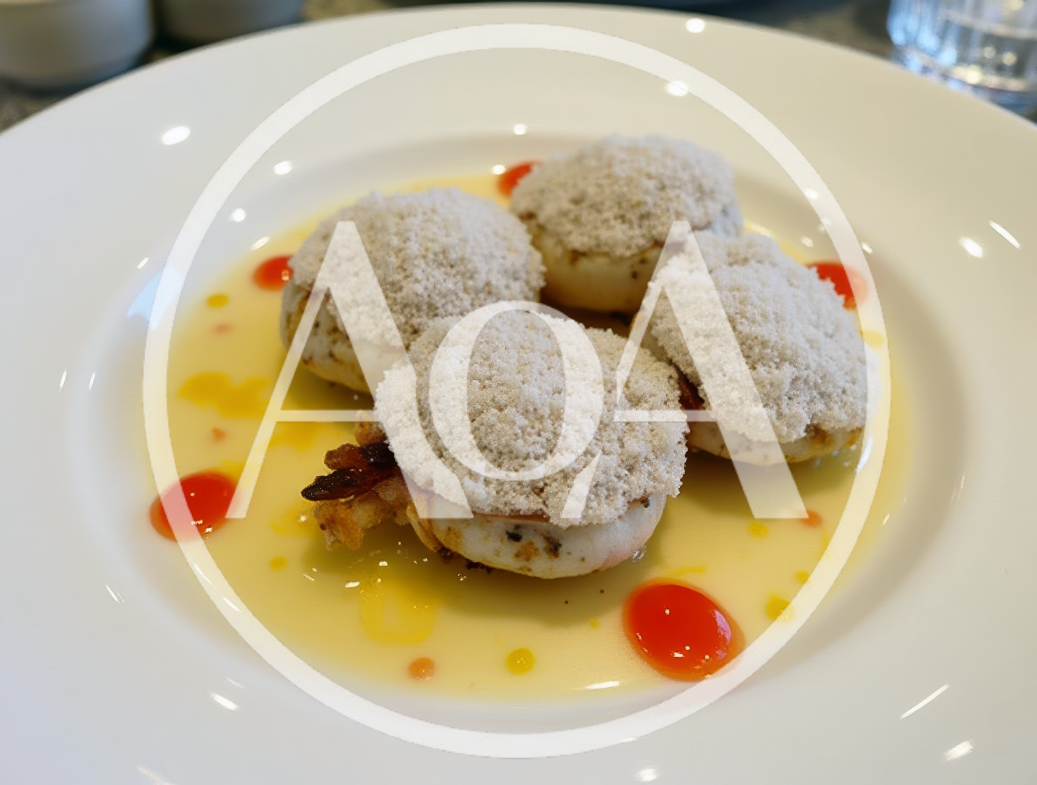 Gourmet Scallop Appetizer With Sauce And Garnishes