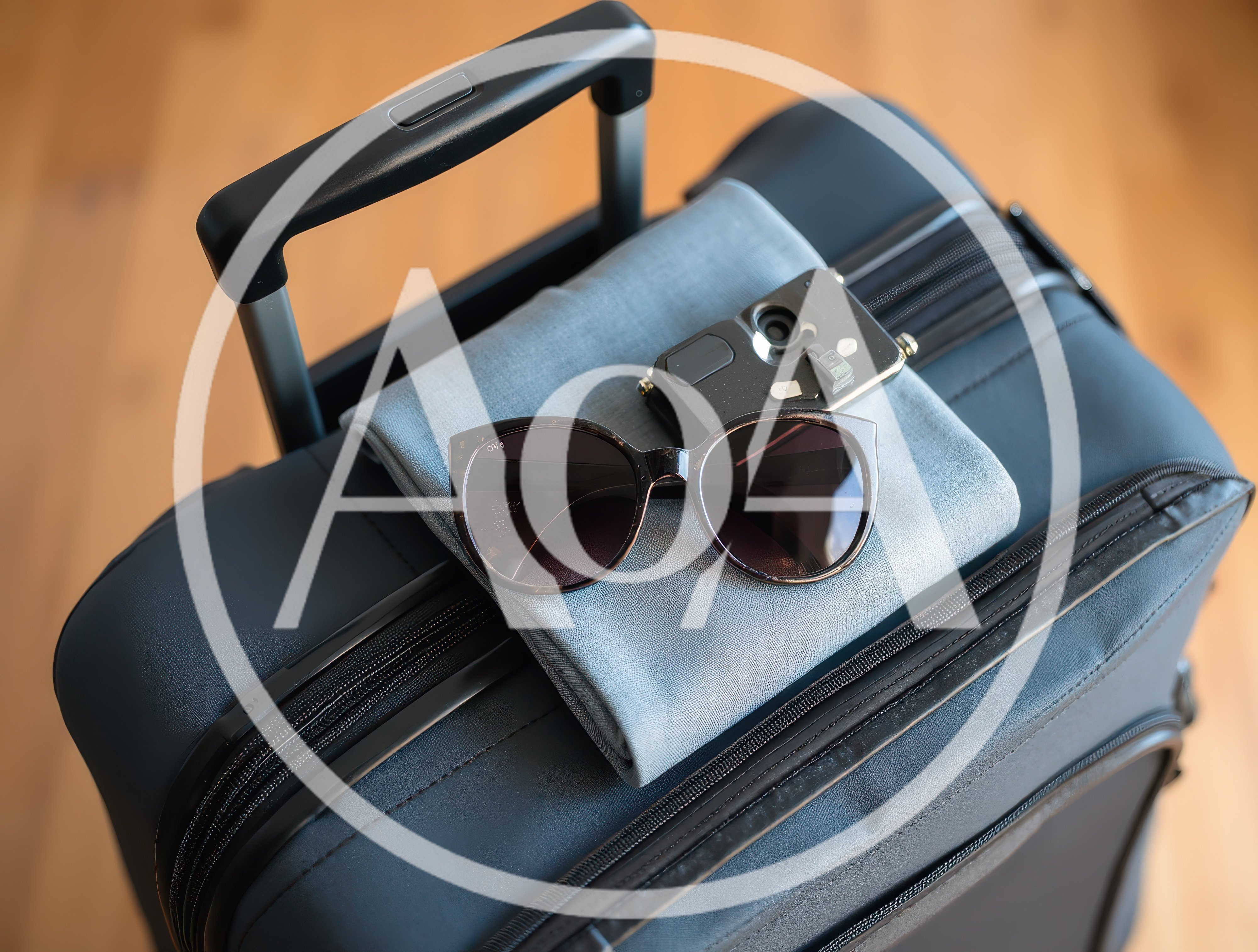 Travel Essentials Packed On A Suitcase