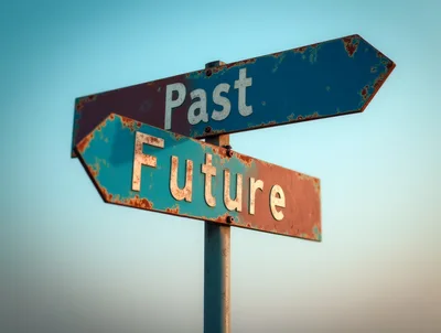 Rusty Metal Directional Signs Pointing To Past And Future