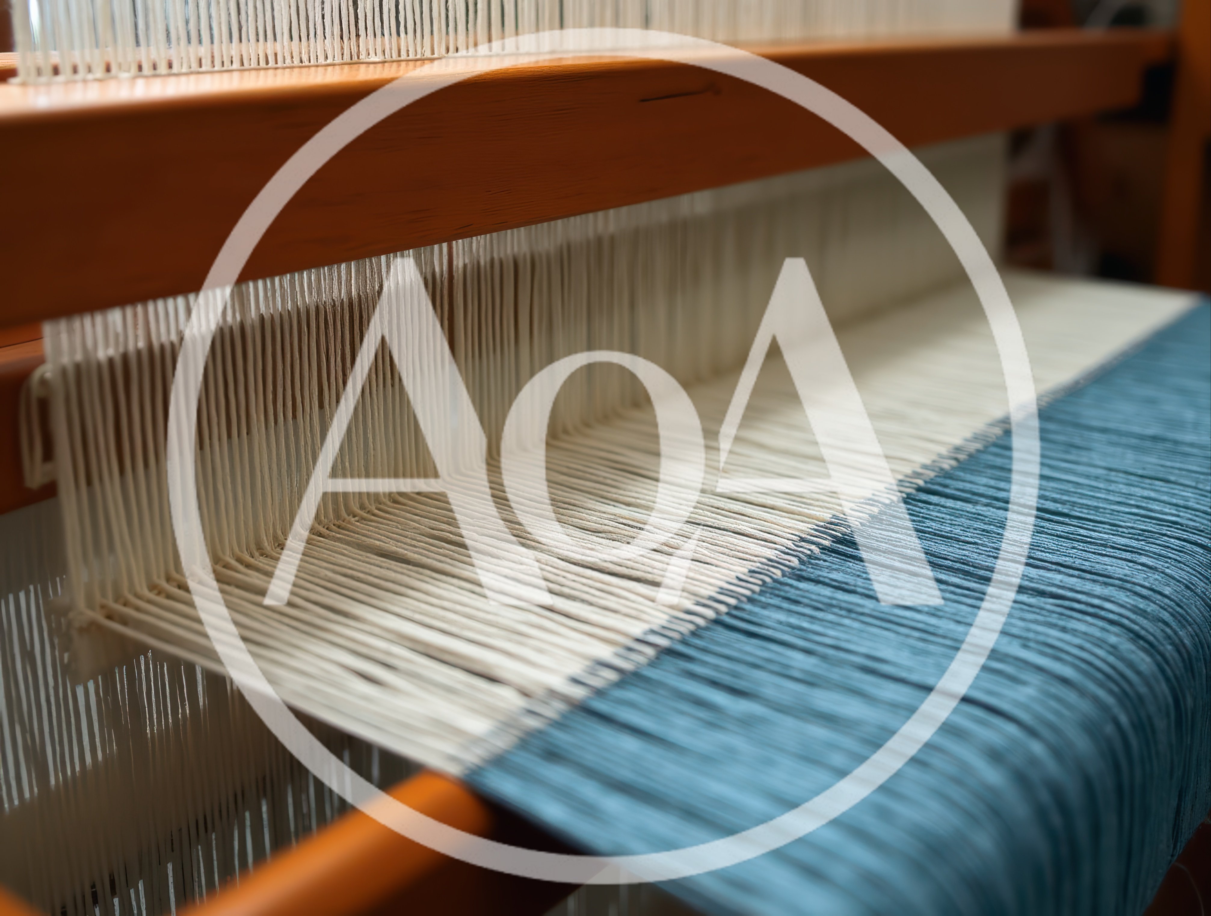 Close Up Of A Loom Weaving Blue And White Fabric
