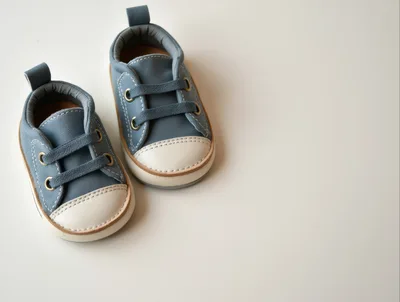 Pair of Blue Baby Sneakers on White Background