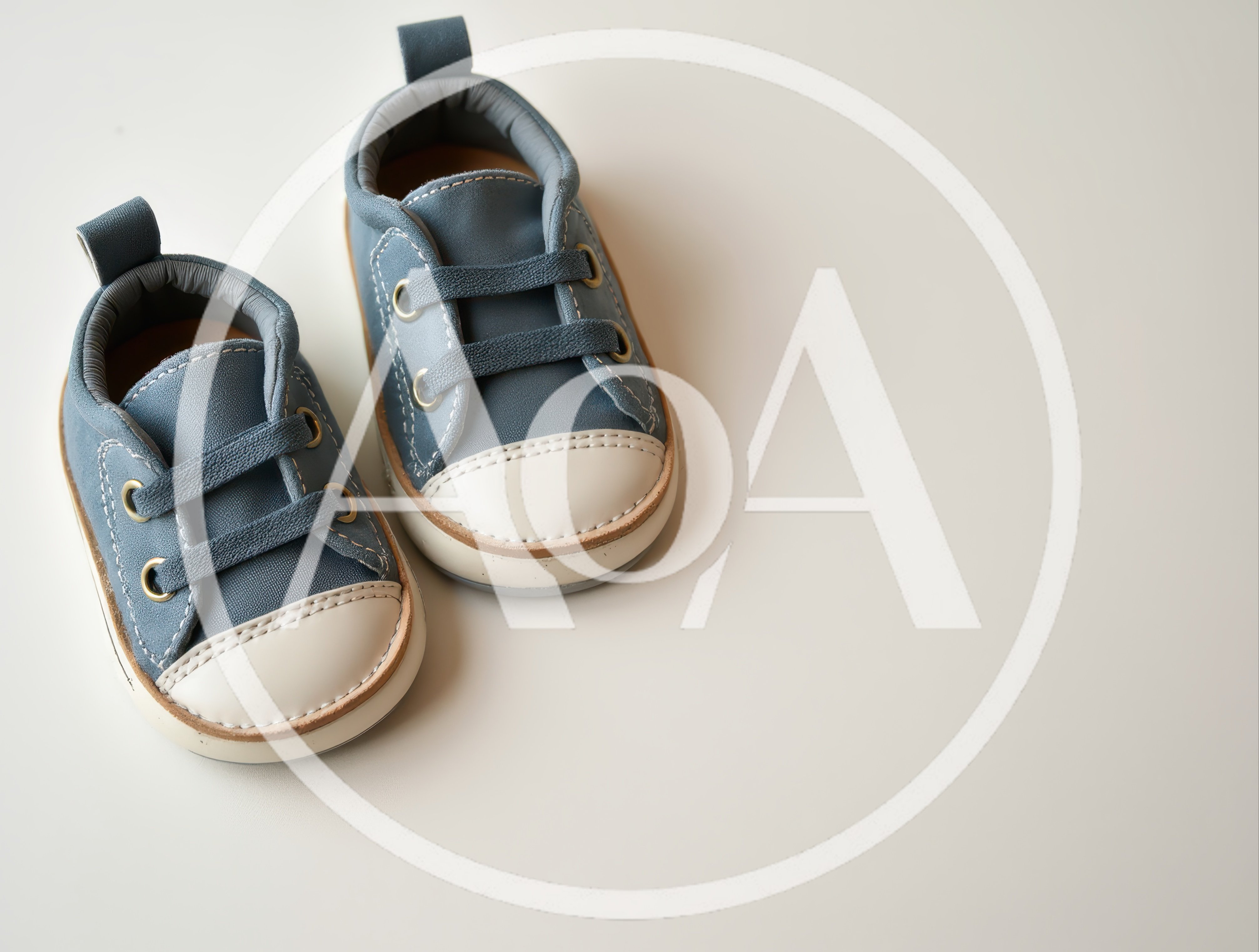Pair of Blue Baby Sneakers on White Background