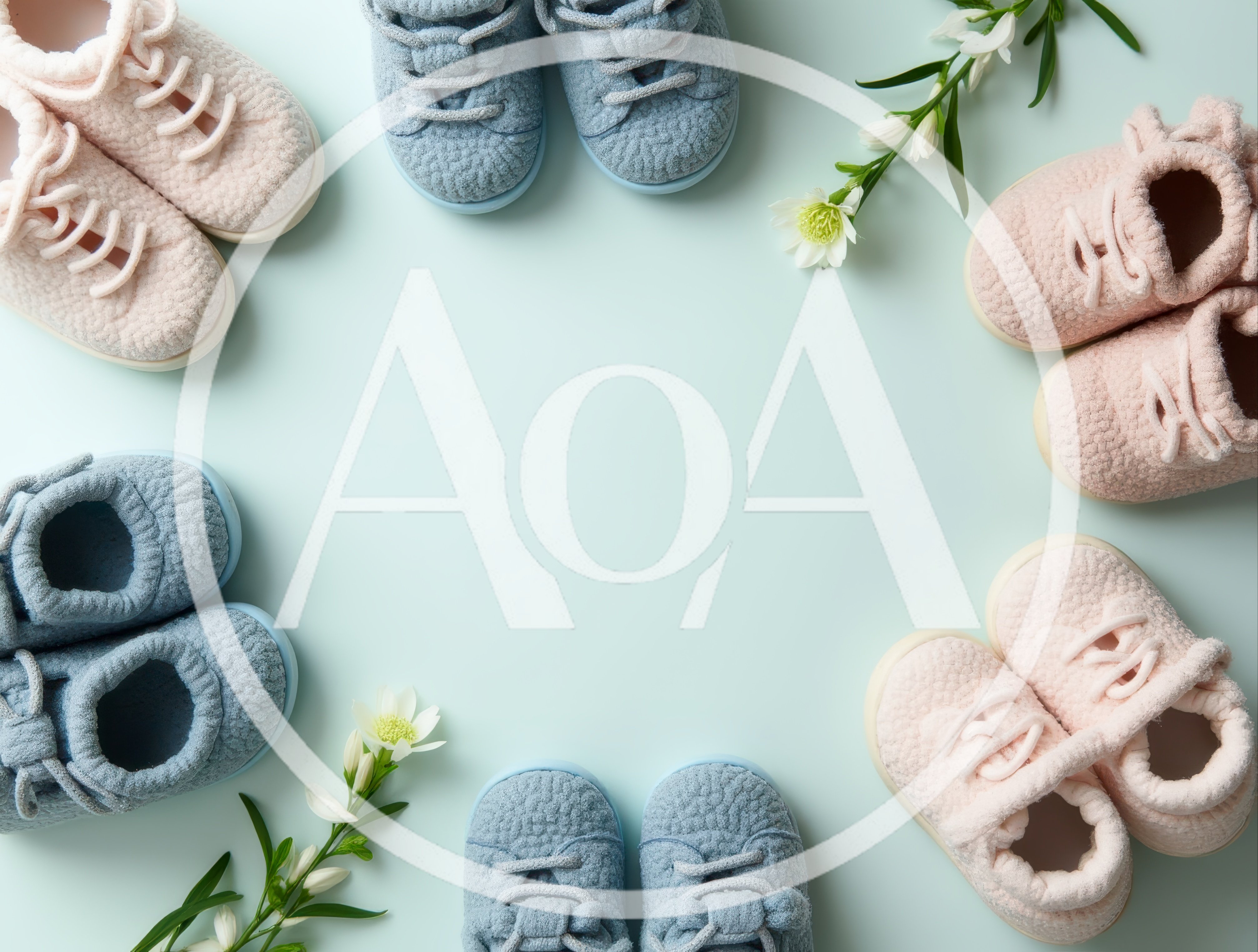Baby Shoes Arranged in a Circle on Light Blue Background