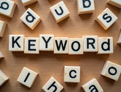 Scrabble Tiles Spelling The Word Keyword On Wooden Surface