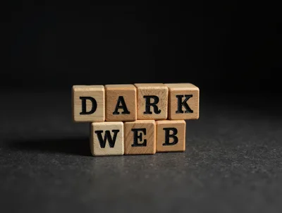 Wooden Blocks Spelling Dark Web on Dark Surface