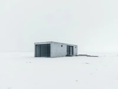 Minimalist Concrete Cabin In A Snowy Landscape
