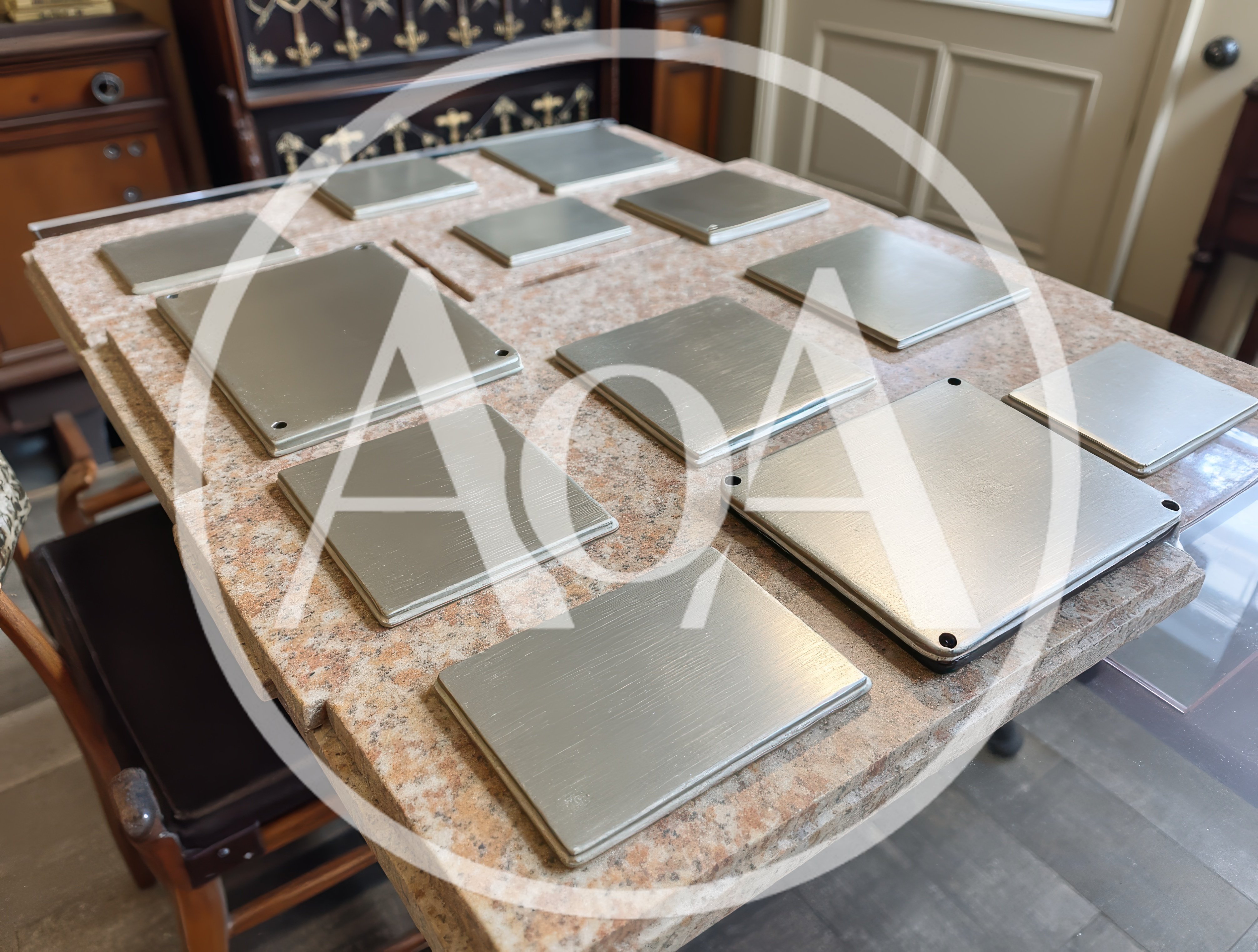 Metal Plates Arranged On A Granite Tabletop