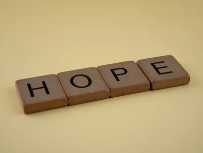 Wooden Scrabble Tiles Spelling The Word Hope