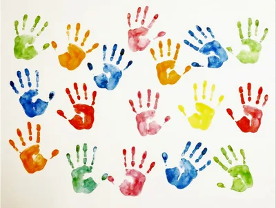 Colorful Handprints Painted on White Background