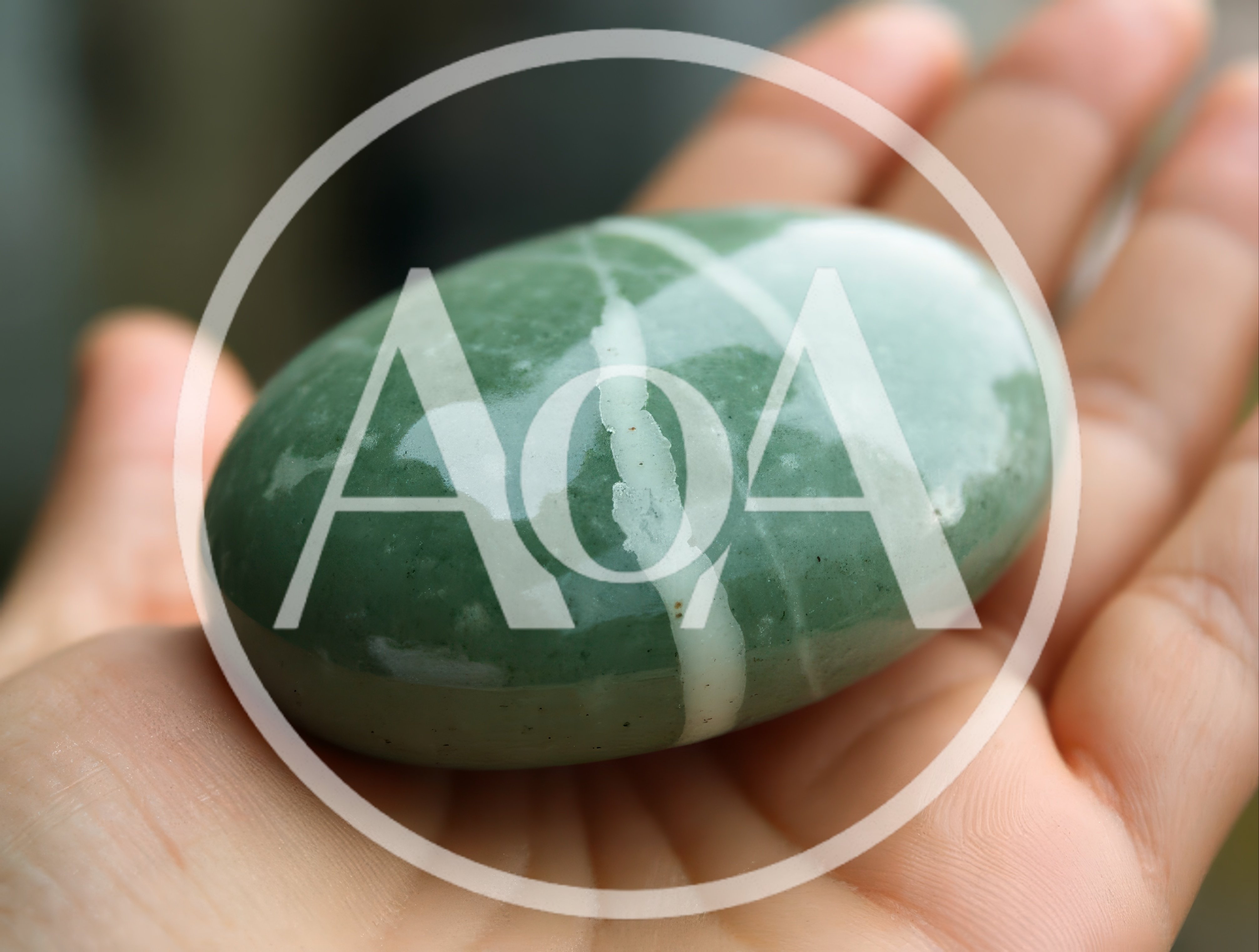 Polished Green Aventurine Stone Held In Palm