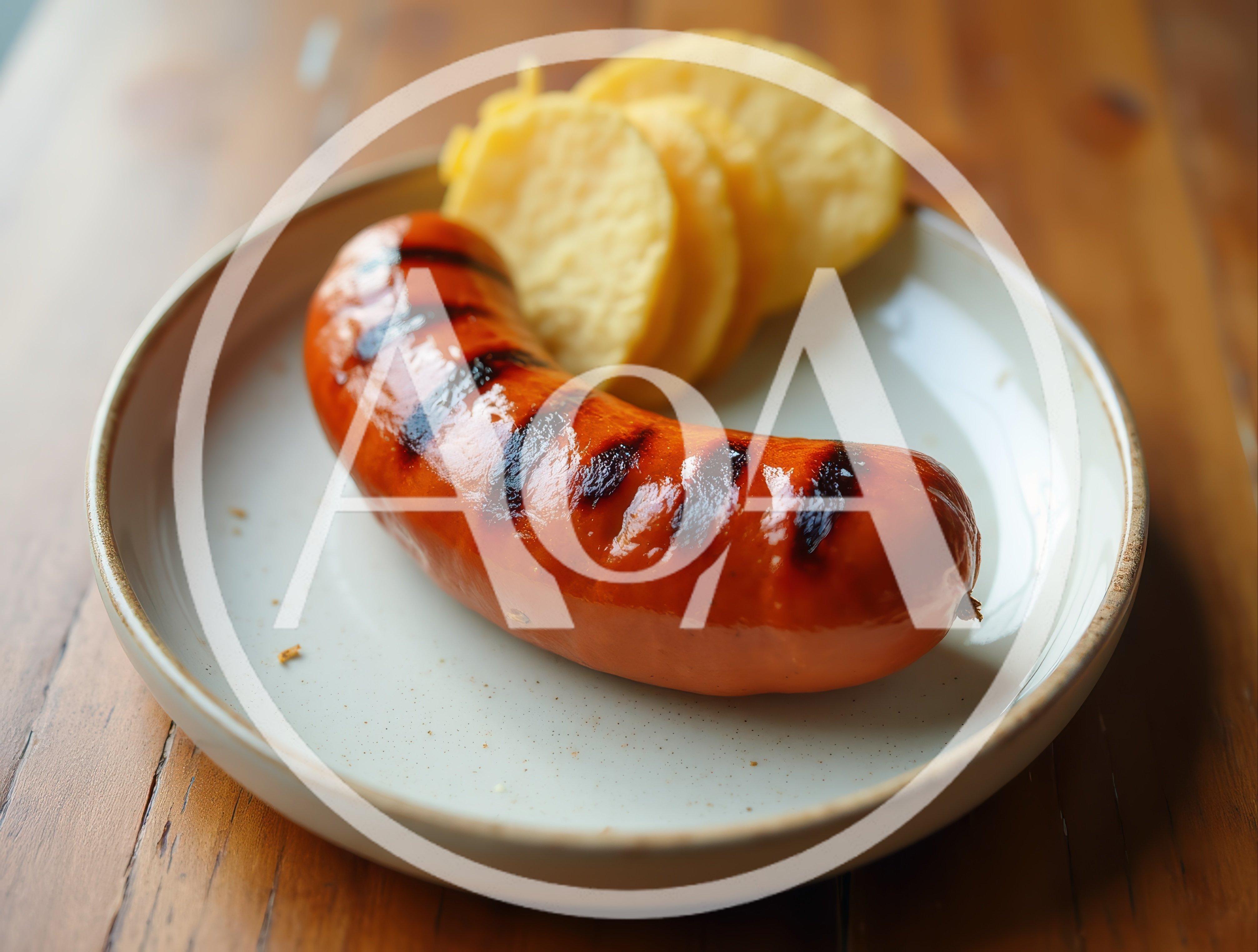 Grilled Sausage With Potato Slices On A Plate