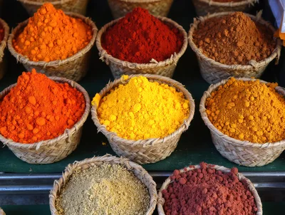 Colorful Spices Displayed In Woven Baskets