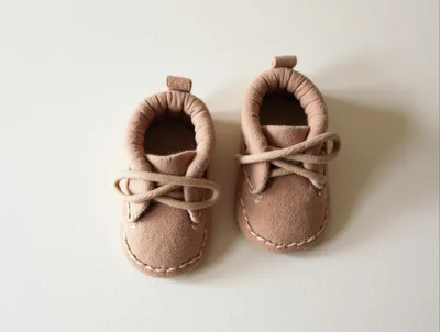 Pair Of Tan Suede Baby Moccasins