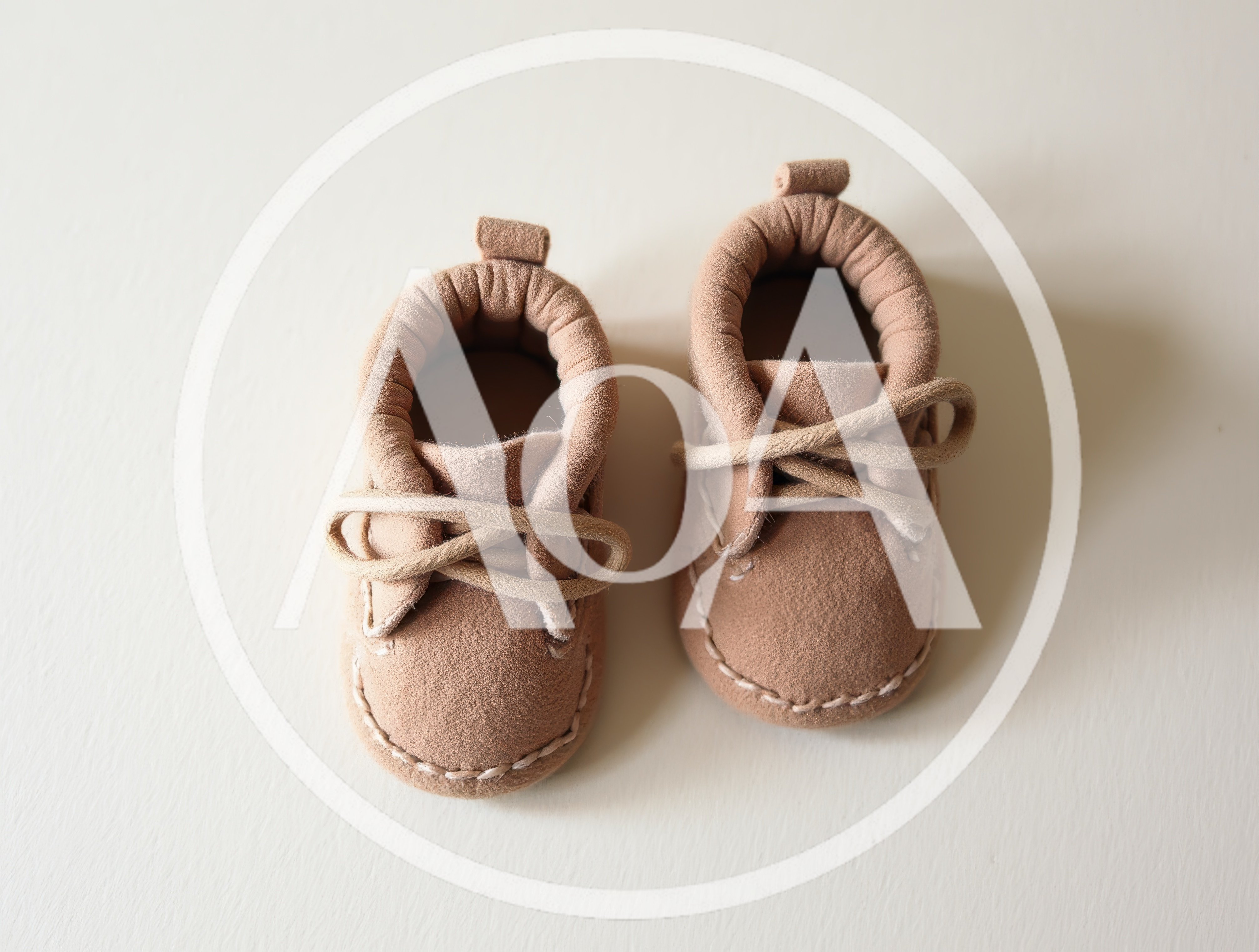 Pair Of Tan Suede Baby Moccasins