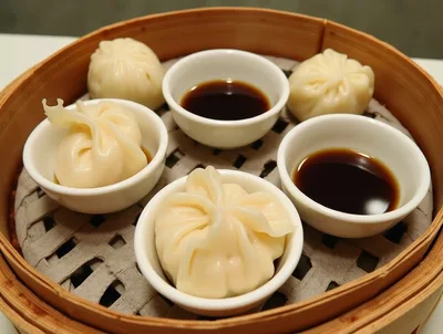 Steamed Soup Dumplings Served In Bamboo Steamer