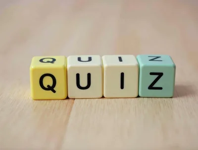 Four Colorful Dice Spelling The Word Quiz